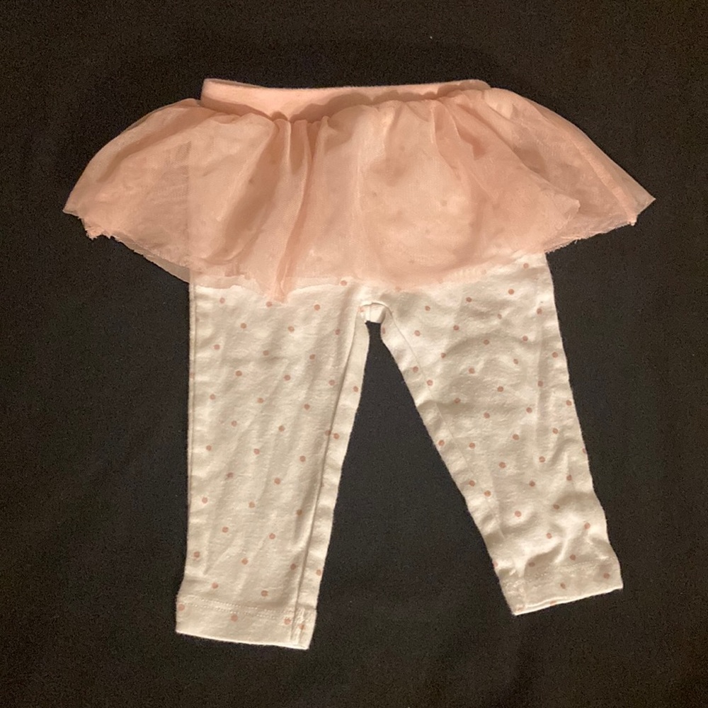 White pants with pink polkadots an pink skirt